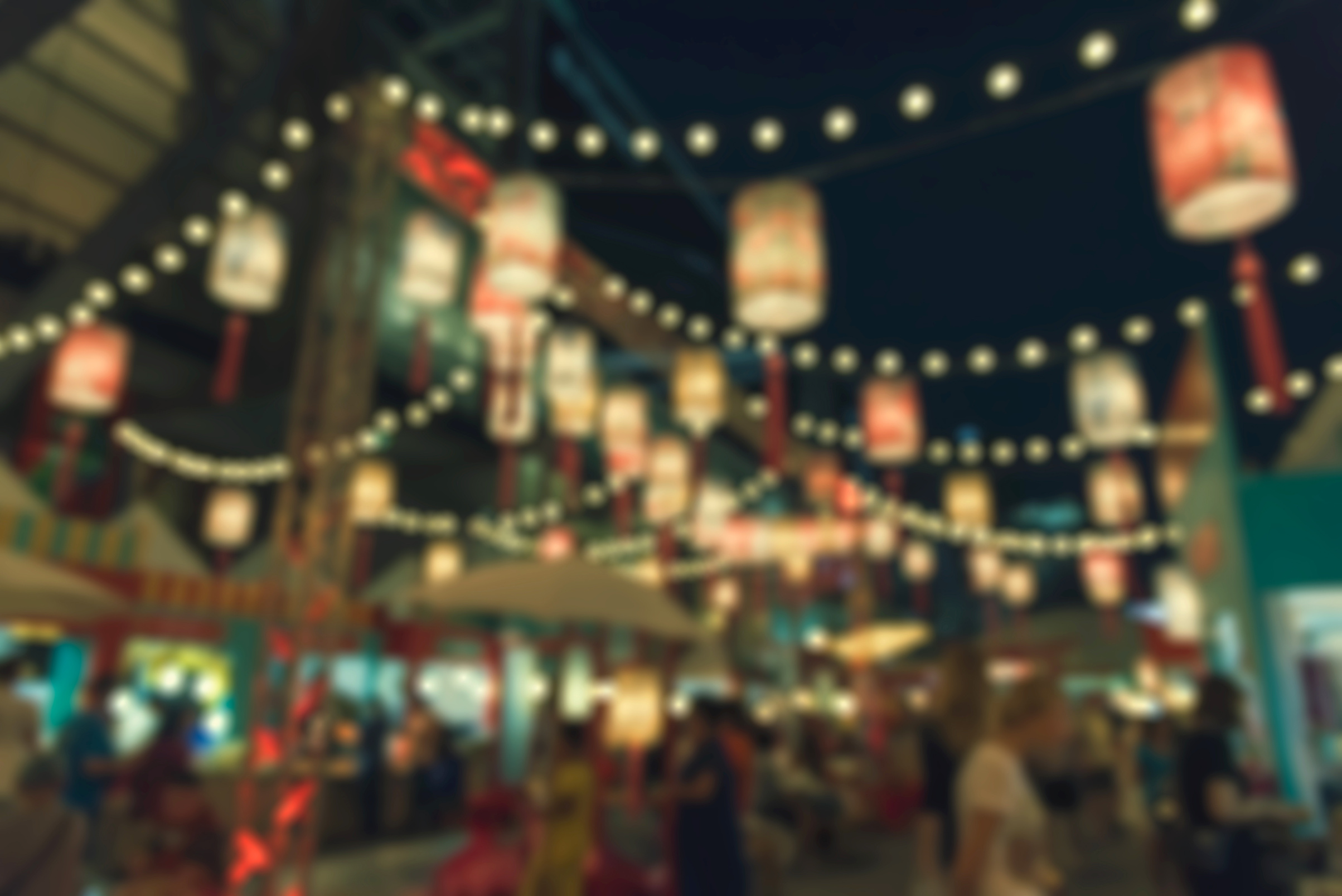 Defocused of night light on street, abstract blurred background with bokeh of city on street at night.